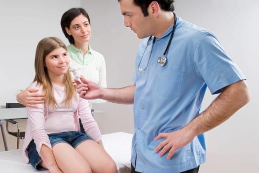 Doctor giving medicine to a patient