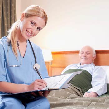 Female nurse preparing the medical report of a patient