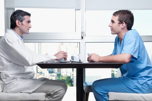 Doctors discussing in a cafeteria
