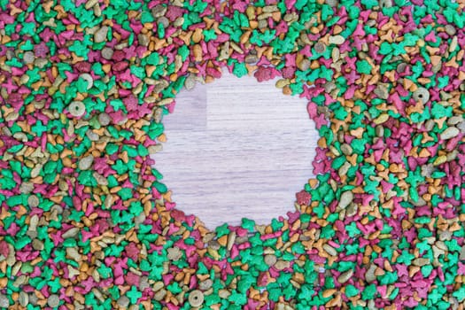 Top view dry cat food on wooden background with copy space