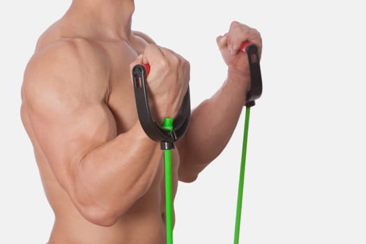 Mid section view of a man exercising with resistance band