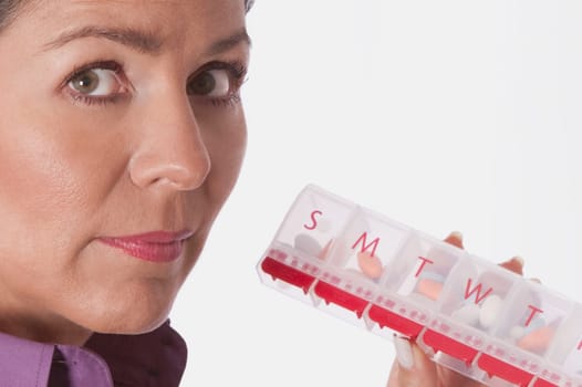 Woman holding a pill box