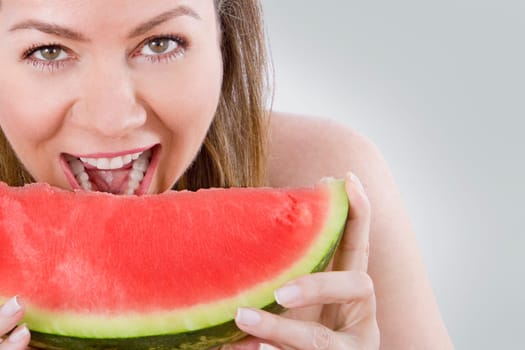 Woman eating watermelon