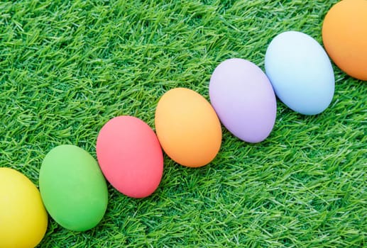 Close up Colorful easter eggs on on green gras background
