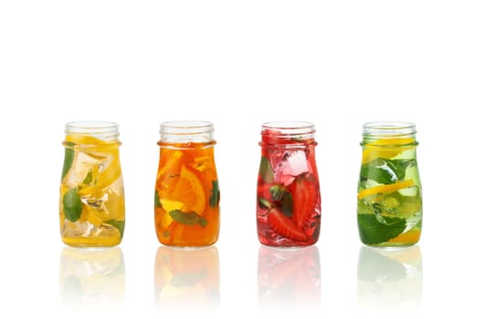 Fresh natural fruit  cocktails with straw on white background.