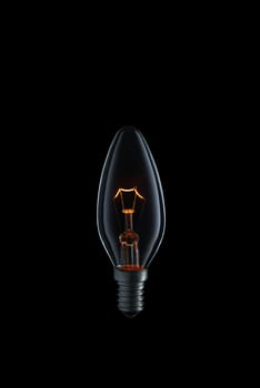 Burning Light bulb on black background.
