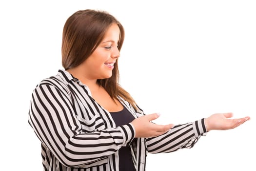 Young large beautiful woman presenting your product, isolated over white background