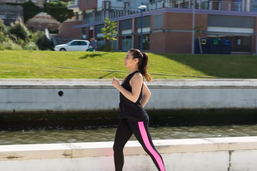 A beautiful young woman making some exercise at the park - fitness concept