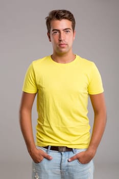 Studio picture of a young and handsome man posing isolated
