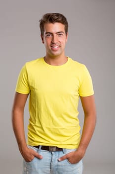 Studio picture of a young and handsome man posing isolated