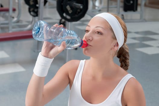 Woman drinking water from a water bottle