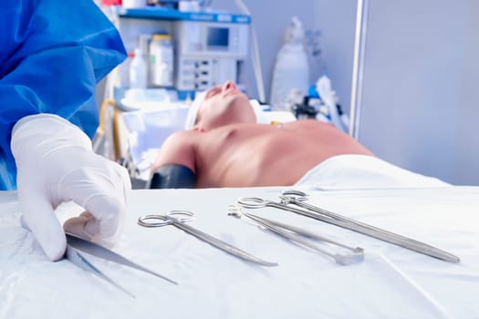 Surgeon holding surgical scissors in an operating room