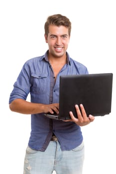 Young handsome man working with laptop computer