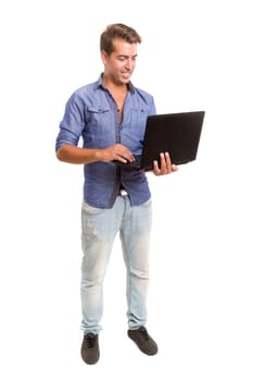 Young handsome man working with laptop computer