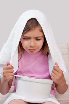 Girl inhaling steam