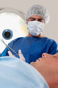 Surgeon with a patient in an operating room