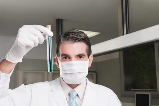 Lab technician analyzing sample in a test tube
