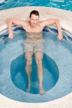 Man relaxing in a hot tub