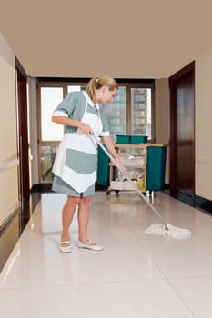 Janitor cleaning the corridor of a hospital