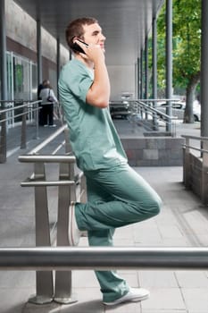 Male nurse talking on a mobile phone