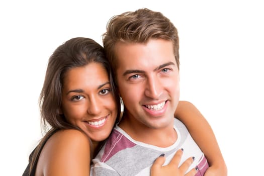 Young couple posing isolated in studio