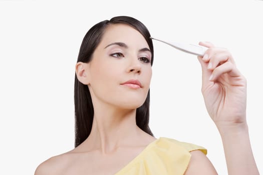 Woman reading a thermometer