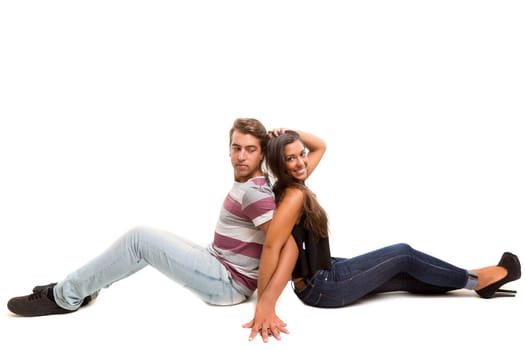 Young couple posing isolated in studio