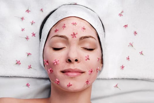Woman receiving facial treatment