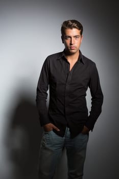 Studio picture of a young and handsome man posing isolated