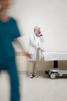 Doctor talking on a mobile phone