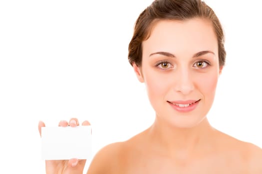 Beautiful fresh woman taking white card - blank. Dressing in pure white background