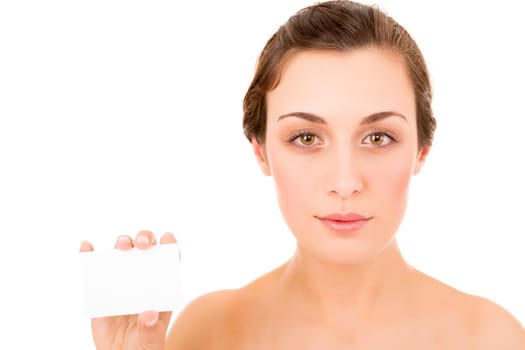 Beautiful fresh woman taking white card - blank. Dressing in pure white background