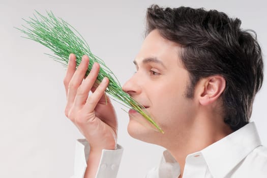Man smelling aroma herbs