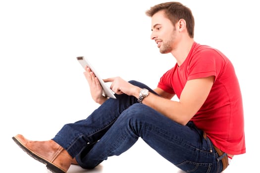 Young happy student working with a new digital tablet computer, isolated