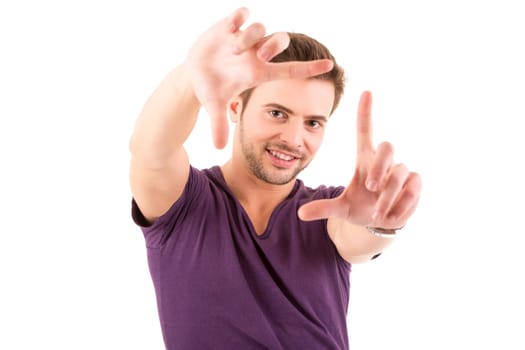 Studio picture of a young and handsome man posing isolated