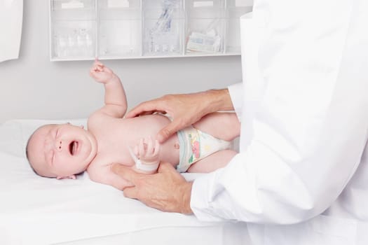 Doctor examining a newborn baby