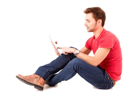 Young happy student working with a new digital tablet computer, isolated