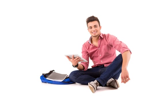 Young happy student working with a new digital tablet computer, isolated