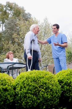 Healthcare worker talking with a patient and smiling