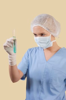 Female lab technician analyzing a test tube