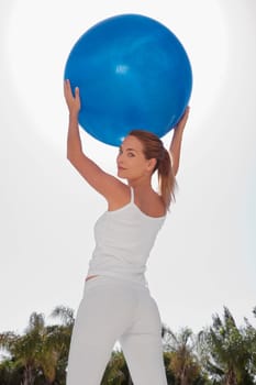 Woman holding a fitness ball
