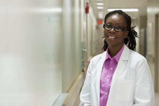 Portrait of a female doctor smiling in a hospital corridor