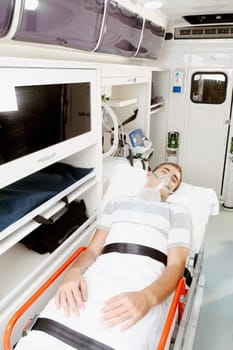 Patient lying in an ambulance