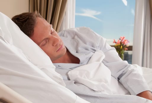 Man lying in a hospital bed