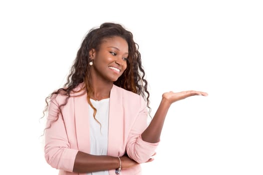 Young beautiful african woman presenting your product, isolated over white background