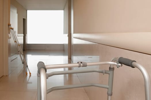 Walker and a crutch in the corridor of a hospital