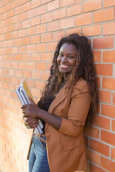 Happy student relaxing at the university campus