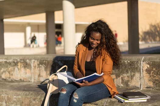 Happy student relaxing at the university campus