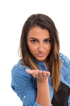 Beautiful young woman blowing you a kiss, isolated over white
