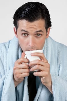Portrait of a man taking hot drink